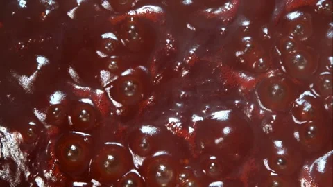 Red liquid sauce boiling and bubbling with high heat intensity Stock Footage 326627308