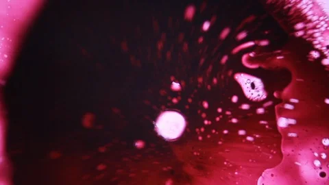 Red liquid splash motion with whit bubbles Stock Footage 127723331