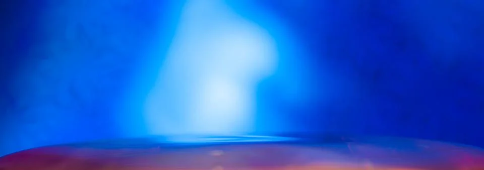 Red liquid surface on a blue background . Stock Photos