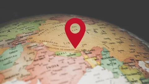 Red location pin drops on spinning globe with detailed Video stock 342952749