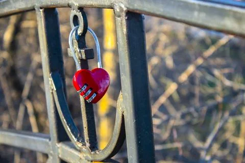 Red lock in the shape of a heart Stock Photos