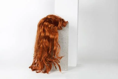 Red long wig cinder block Stock Photos