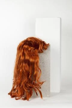 Red long wig cinder block Stock Photos