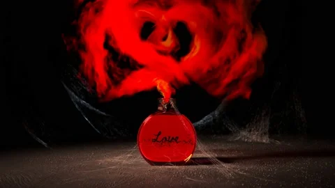 Red Love Elixir in Glass Bottle with Spiderwebs and Heart Shaped Smoke Stock Footage 237631368