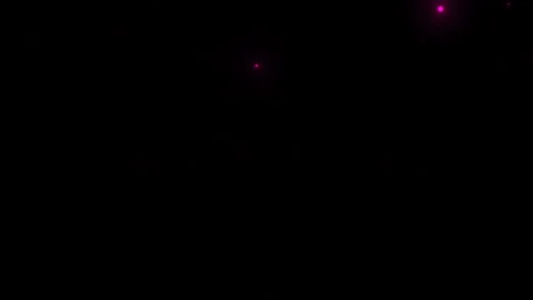 Red luminous particles fall on a black background, bounce and sway smoothly Stock Footage 130407650