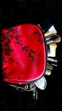 Red make up bag with brushes in it Stock Photos