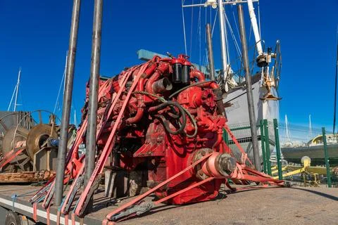 Red Marine Engine Secured on Trailer at Boat Yard 스톡 사진