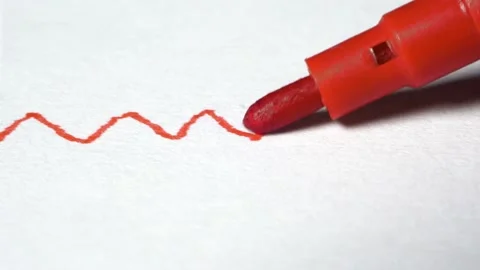 Red marker drawing zig zag lines. Drawing red curve on a white paper Stock Footage 164075257