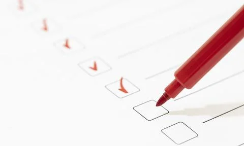 Red marker with markers on the checklist sheet. Checklist completed task Stock Photos