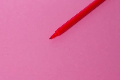 Red marker. On a pink background. Empty space for an inscription. Stock Photos