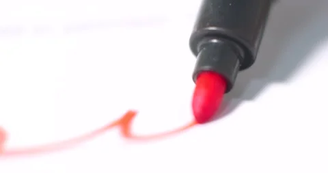 Red marker sketching dynamic lines, creating expressive scribbles across white Video stock 313593550