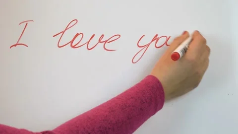 A red marker write the words - i love you 4K Video stock 102470334