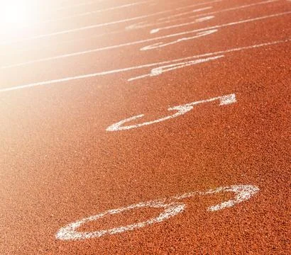 Red markings on the racetrack at the stadium on soft sunlight Stock Photos