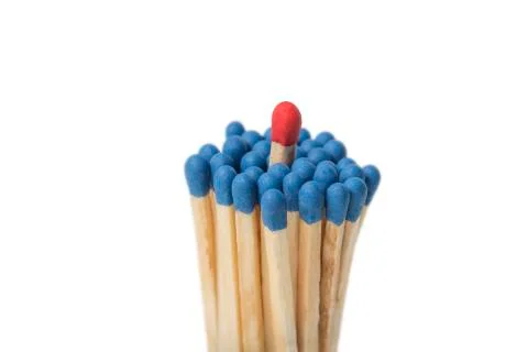 Red Match in group of blue matches Stock Photos