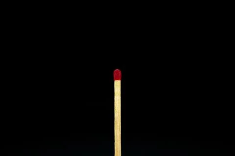 A red match isolated on a back background. top view Stock Photos