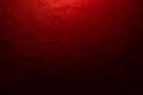 Red matte background of suede fabric, closeup. Velvet texture of seamless lea Stock Photos