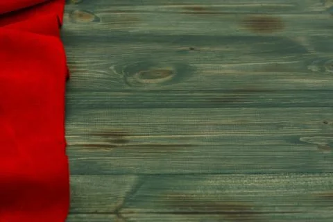 Red matte background of suede fabric, closeup. Velvet texture of seamless lea Stock Photos