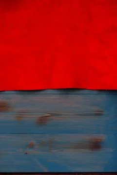 Red matte background of suede fabric, closeup. Velvet texture of seamless lea 写真素材