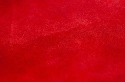 Red matte background of suede fabric. Velvet texture of seamless leather. Fel Stock Photos