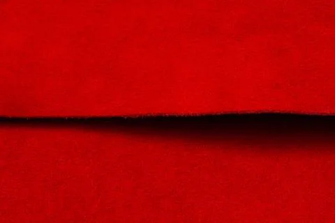 Red matte background of suede fabric. Velvet texture of seamless leather. Fel Stock Photos