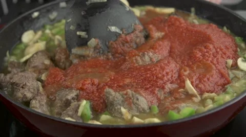 Red meat sauce boiling in the pan Stock Footage 55973214