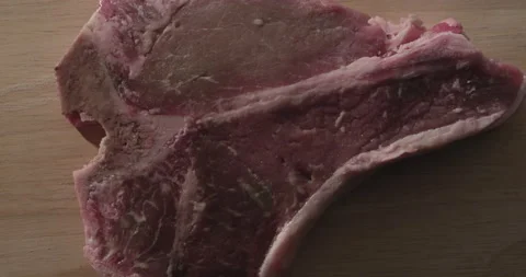 Red Meat Steak on table, T-Bone steak Stock Footage 146416623