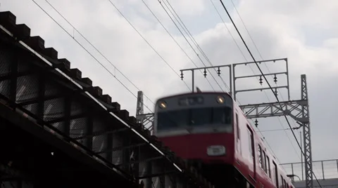 Red Meitetsu Train on Bridge Stock Footage 32237687