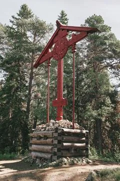 Red memorial cross on the Solovetsky archipelago. Stock Photos