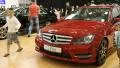 Red Mercedes-Benz C-class at automotive-show HD Footage