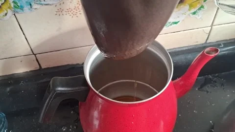 Red metal coffee pot receiving fresh drip brew motion video footage Stock Footage 339247353