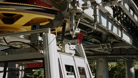 Red metal flag bounces off as cable car cab goes through, with funicular Stock Footage 226181541