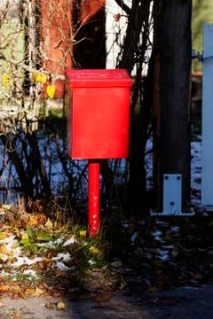 A red metal mailbox in sunset Stock Photos