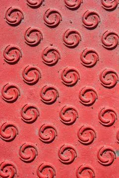 Red metal plate texture background with circular pattern Stock Photos