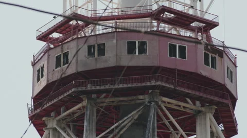 A red metal television tower with broken windows Stock Footage 261406005