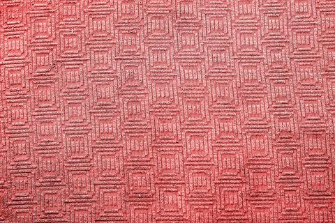 Red metallic abstract textural background. Pattern, embossment. Foto stock