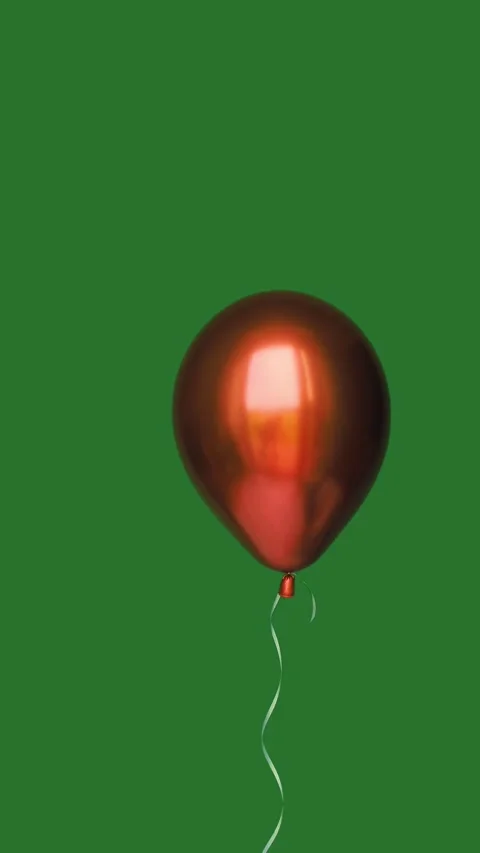Red metallic balloon floating with a curling ribbon on a blue background. Video stock 339354268