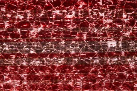 Red metallic fabric texture macro shiny holographic background close up 스톡 사진