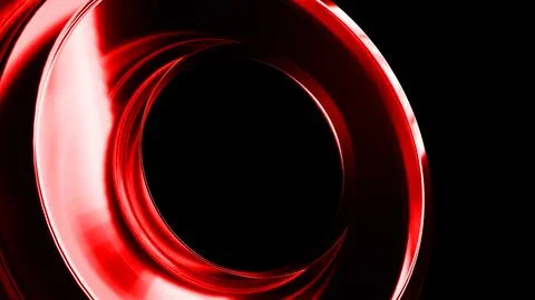 Red metallic ring rotating on black background Stock Photos