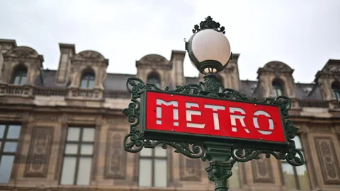 Red metro sing with a building on the background in Paris, France Stock Footage 278100972