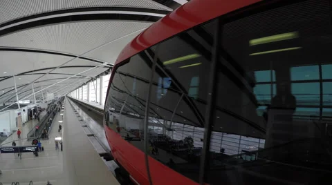 Red Monorail slowing moving down track away from camera Stock Footage 49166892