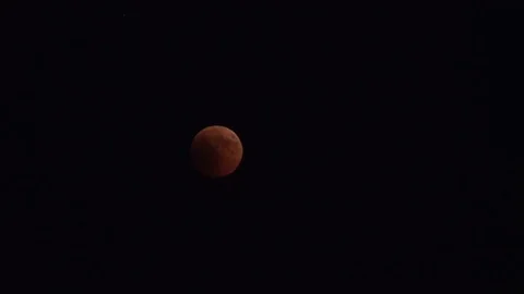 Red moon on a dark sky Stock Footage 93778618