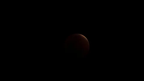 Red moon lunar eclipse at night with cloud real no CG.4k Stock Footage 90180467