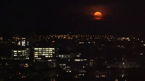 Red Moon Over City Video stock 12604975