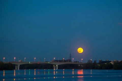 The red moon is reflected in the water Stock Photos