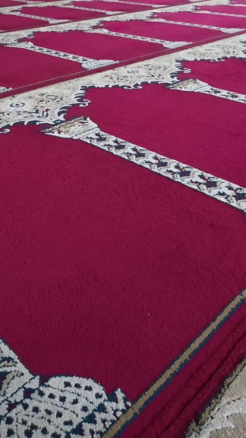 Red mosque prayer carpet with ornate patterned rows Stock Footage 342577439