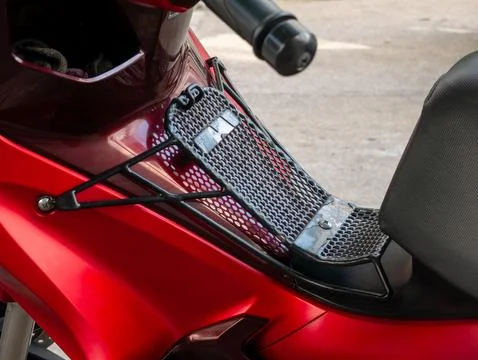 Red Motorcycle Front Storage Rack with Black Mesh Grid for Carrying Items Stock Photos