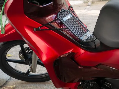 Red Motorcycle Front Storage Rack with Black Mesh Grid for Carrying Items Stock Photos