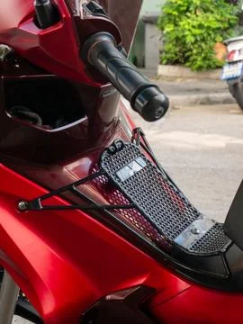 Red Motorcycle Front Storage Rack with Black Mesh Grid for Carrying Items Stock Photos