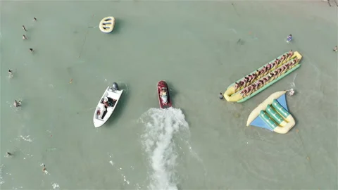 Red motorcycle pulls up to the shore Stock Footage 144801119