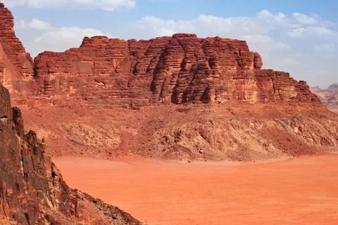Red mountains of the canyon of Wadi Rum desert in Jordan. Stock Photos